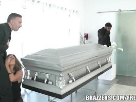 Naughty guy hotly fucks hot brunette at funeral by the casket